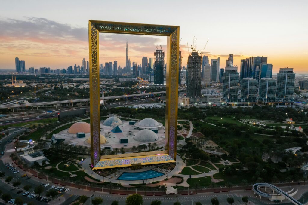 “Backpacker capturing skyline views while on a Dubai budget trip, making the most of affordable  experiences.” dubsi frame

