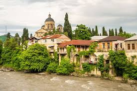 Riverfront houses near a church